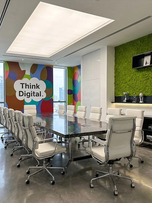 A working manufacturing corporate floor — open-plan functional zones positioned for cross-functional coordination
